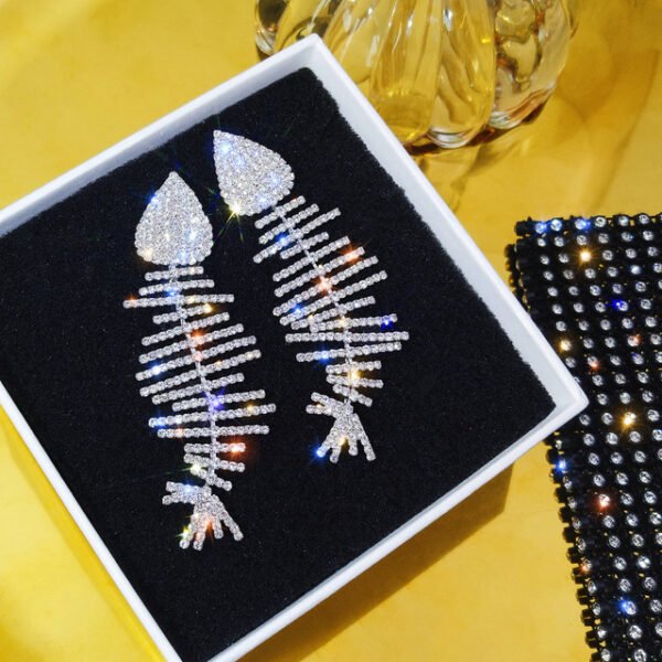 Long Bouncy Crystal Crusted Fish Bone Earrings