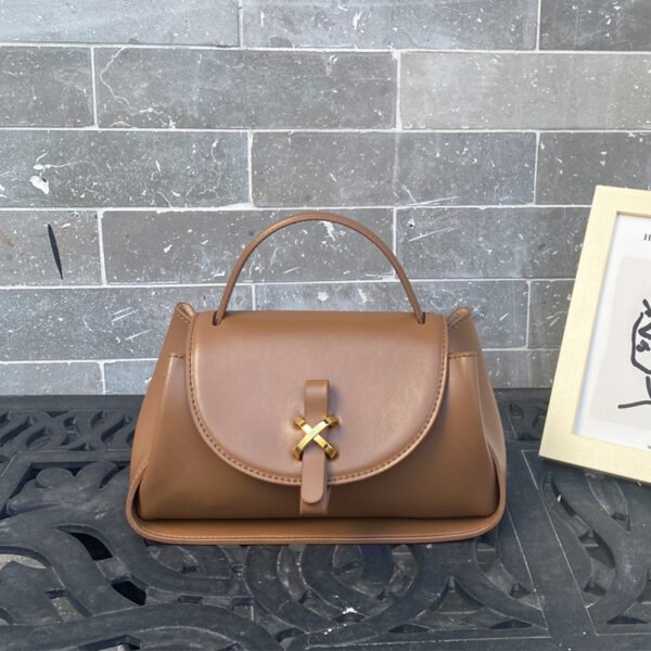 Leather Shoulder Bag With Magnetic Buckle on counter